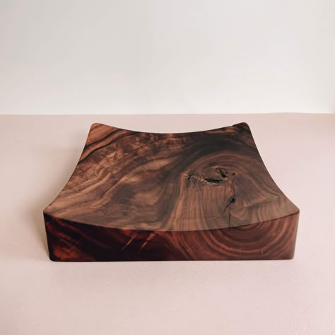 Minimal and absolutely stunning, this catchall tray is carved out of a solid piece of figured Walnut with a single spherical divot to organize and display your finest accessories. Perfect for your desktop, credenza, countertop, dresser, coffee table, and more - perfectly sized to accommodate a wide array of items you wish to organize or just lovingly display. Details: Made to order. Each tray is sanded and finished by hand, with a tough wax/oil hybrid wood finish to highlight all of the stunning Workshop Organisation, Walnut Wood Projects, Carved Tray, Catchall Bowl, Vanity Organizer, Large Workshop, Woodworking Business, Catchall Tray, Walnut Burl