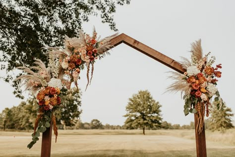 Muted sunset tones on wedding arbor Wedding Arbor Rustic Fall Ceremony Arch, Terracotta Wedding Arbor, Arbor Ideas Wedding Rustic, Unique Wedding Arbor Ideas, Fall Arbor Decorations, Wedding Ceremony Arbor Ideas, Boho Arbor Flowers, Fall Wedding Arbor Decor, Boho Wedding Arbor Ideas