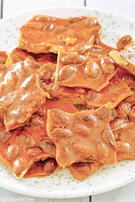 Almond brittle is delicious and crispy candy enjoyed for generations. Get the easy recipe and learn how to make the best brittle with almonds. Find out a simple ingredient swap to make almond brittle with no corn syrup. A great candy to make for the holidays and homemade gifts. #almondbrittle #easycandyrecipe #christmascandy Cherry Mash Candy Recipe, Almond Brittle, Easy Candy Recipes, Brittle Recipes, Candied Almonds, Candy Truffles, Copykat Recipes, Beef Casserole Recipes, Peanut Brittle