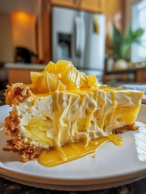 No-Bake Pineapple Heaven Cheesecake Dessert 🍍    Ingredients ❤️  Crust 👌  🍪 2 cups graham cracker crumbs 🧈 1/2 cup melted butter Cheesecake Filling: 🧀 2 cups cream cheese, softened 🍚 1 cup powdered sugar 🥛 2 cups heavy whipping cream 🍍 1 can (20 oz) crushed pineapple, drained Topping: 🍍 1 can (20 oz) pineapple rings, drained 🍓 Fresh raspberries for garnish 🍦 Whipped cream for topping No Bake Cheesecake Dessert Cups, Baked Pineapple, Decadent Food, Pineapple Rings, Cheesecake Dessert, Cheesecake Mousse, Cheesecake Cake, Easy Cheesecake Recipes, Fresh Raspberries