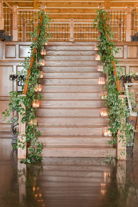 | wedding staircase decor with greenery + candles | elegant wedding staircase decorations | wedding venue staircase decor | 2018 wedding decorations | elegant wedding decorations | 2018 wedding decorations | photo taken at THE SPRINGS Event Venue. follow this pin to our website for more information, or to book your free tour! SPRINGS location:  The Lodge in Denton, TX photographer:  Kylie Crump Photography #weddingdecor #weddingdecorations #weddingreception #2018wedding #weddinginspiration #dfw Stair Decorating Ideas For Wedding, Staircase Florals, Wedding Staircase Decoration, Wedding Stairs, Wedding Staircase, Wedding Reception Design, Staircase Decor, Stair Decor, Farmhouse Wedding