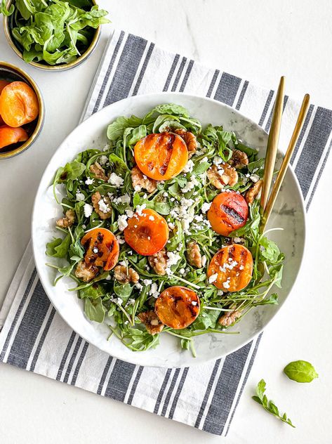 Grilling fruit is deepening the flavors of your favorite dishes. Apricot is one of my favorite fruit to grill and is the perfect combination for salty feta cheese, peppery arugula and crunchy candied walnuts. Grilling apricots makes them sweeter and delicate and so delicious as a result. Serve this Grilled Apricot & Candied Walnut Arugula Salad with the most simple dressing - extra virgin olive oil and balsamic glaze - and enjoy it to the fullest. Apricot Salad, Grilled Apricots, Arugula Salad With Apples, Arugula Salad With Figs, Arugula Salad With Apples And Pecans, Arugula Salad With Pears And Goat Cheese, Arugula Peach Burrata Salad, Spicy Walnuts, Cooking Bowl