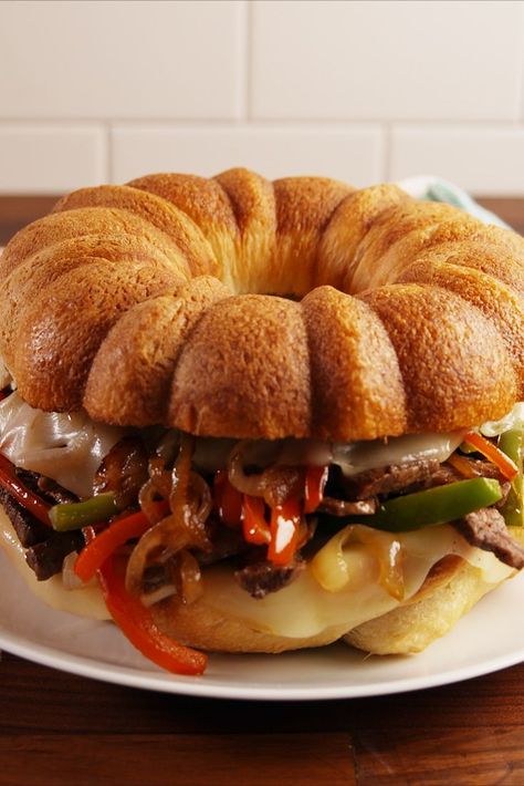 Giant Philly CheesesteakDelish Super Bowl Food Menu, Bundt Pan Recipes, Cheesesteak Sandwich, Philly Cheesesteaks, Steak Dinner Recipes, Steak Sandwich Recipes, Bundt Recipes, Philly Cheese Steak Recipe, Cheesesteak Recipe