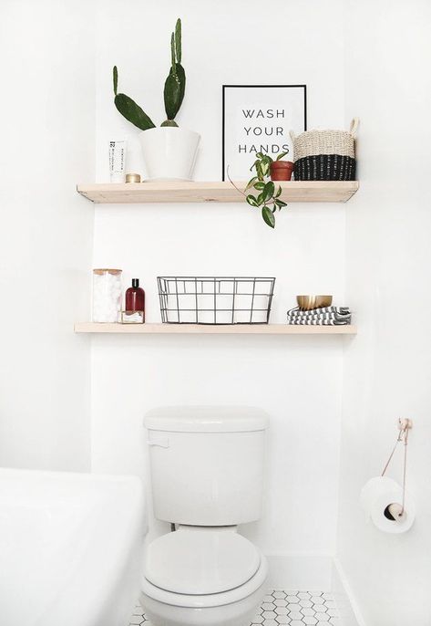 Here are some of our favorite Scandinavian bathroom storage ideas to get your sink, shower, and toilet area in tip-top shape. #hunkerhome #scandistyle #bathroom #bathroomstorageideas #bathroomstorage Above The Toilet Storage, Baie Vintage, Small Half Baths, Modern Vintage Bathroom, Diy Shelves Bathroom, Small Half Bath, Bilik Air, Interior Boho, Diy Bathroom Storage