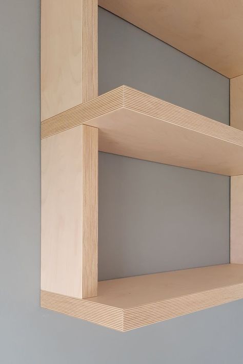 Custom TV console and bookcase design. The bookcase, in birch plywood with joints between shelves and side panels, seems to hang from the ceiling as it descends along the wall to approach the lacquered Blue base. The contrast between the simplicity of the wood, emphasized by the exposed plywood heads, and the base finished with a refined embossed lacquering, makes the piece of furniture simple and at the same time elegant and modern. Plywood Wall Shelf, Plywood Wall Shelves, Plywood Bookshelf Wall, Plywood Library, Plywood Bookshelf, Plywood Bookcase, Stairwell Ideas, Plywood Design, Plywood Interior