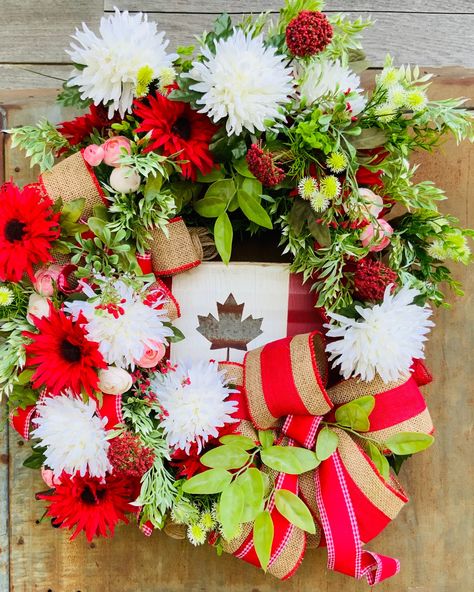 "Welcome to our shop! You are viewing Patriotic CanadianWreath / Patriotic Decor / Canadian Wreath / Canadian Decor / Canada Day Decor / Maple Leaf Wreath / Canada Day / Canada  Welcome summer with this beautiful large patriotic wreath. This rustic style decor is made on an 18\" oval  grapevine. This Canadian Patriotic wreath is adorned with 2 beautiful large burlap bows and a hand painted metal Canadian Maple Leaf sign to complete the rustic farmhouse style. This is a gorgeous wreath full of be Canadian Wreath, Canadian Decor, Maple Leaf Wreath, Rustic Style Decor, Canadian Maple Leaf, Welcome Summer, Patriotic Decor, Canadian Maple, Burlap Bows