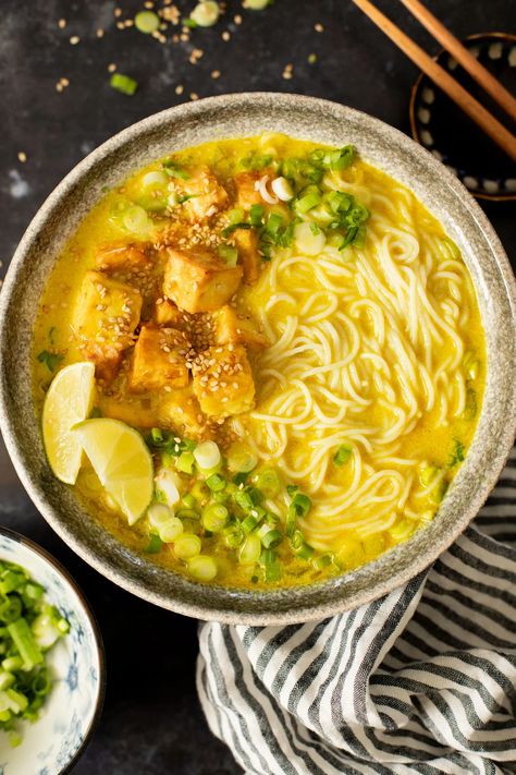 This Golden Coconut Noodle Soup is healthy & heart warming. A coconut curry broth, crispy baked tofu & tender rice noodles | ThisSavoryVegan.com #vegansoup #noodlesoup #healthysoup Coconut Noodle Soup, Vegetarian Noodle Soup, Curry Broth, Crispy Tofu, Baked Tofu, Savory Vegan, Vegan Soups, Healthy Heart, Dinner Plan