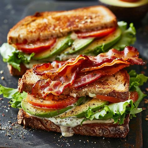 🥑🥓 Enjoy our Loaded Avocado BLT for a healthy twist on a classic! 🥑🥓 #HealthyEats #BLTLovers Loaded Avocado BLT Ingredients: Bacon (6 slices, cooked) Romaine lettuce (4 leaves) Tomato (1, sliced) Avocado (1, sliced) Whole grain bread (4 slices) Mayonnaise (2 tbsp) Salt (1/2 tsp) Black pepper (1/2 tsp) Instructions: Toast bread slices. Spread mayonnaise on one side of each slice. Layer lettuce, tomato, avocado, and bacon on two slices. Sprinkle with salt and pepper. Top with the remaining ... Blt With Avocado, Loaded Avocado, Avocado Blt, Sliced Avocado, Tomato Avocado, Instagram Recipes, Grain Bread, Toast Bread, Trending Recipes