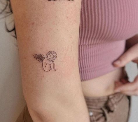 Baby Cupid Tattoo, Small Cupid Tattoo, Cute Dainty Tattoos With Meaning, Tiny Angel Tattoo, Little Angel Tattoo, Tattoos Simplistic, Small Angel Tattoo, 222 Tattoo, Angle Tattoo