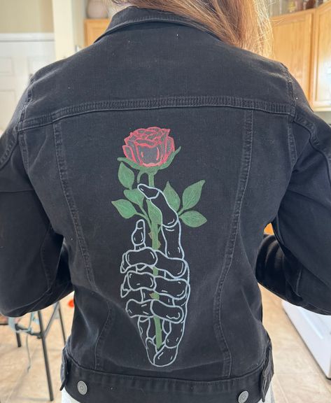 Hand painted custom jean jacket. Skeleton hand holding rose. Other designs available. Design available in color or black and white. Sizes run small. Painted with high quality fabric paint. Skeleton Hand Holding Rose, Hand Holding Rose, Skeleton Hand Holding, Painted Jean Jacket, Custom Jean, Custom Jean Jacket, Black Jean Jacket, Custom Jeans, Painted Jeans