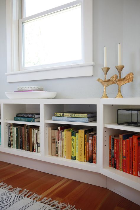 A Colorful Seattle House Tour- low bookshelves Window Bookcase, Under Window Bookcase, Low Bookshelves Bedroom, Floating Shelf Under Window, Long Short Book Shelf, Built In Low Bookshelves, Low Built In Bookshelves, Low Bookshelves Under Window Living Room, Bookshelf Bench Seat