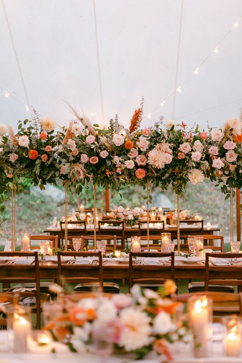 Rattan and weddings are a match made in heaven. Truth! This boho chic wedding with a forest ceremony and decked up tented reception is the living proof. With rattan pendants and chargers, blue toile napkins and a beer stein escort card display, this couple went all in for a laidback fall wedding that reflected their style and story to a T! See it now on Ruffled Blog #weddingbackdrops #bridalkaftan #tallcenterpieces Fall Wedding Greenery Decor, Boho Chargers Wedding, Tent Decor For Wedding, Wood Tables Wedding Reception, Boho Chic Wedding Table Decor, Boho Tent Wedding Reception, Fall Tent Wedding Reception, Tent Fall Wedding, 2024 Fall Wedding Colors