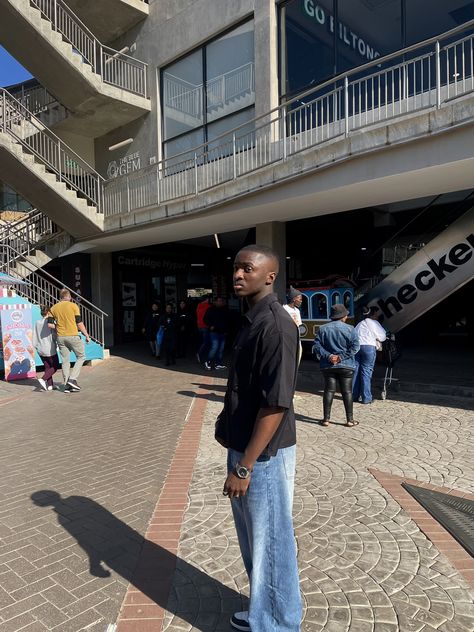 Baggy blue jeans, a black cropped t shirt and jordan 1s, dark skin Blue Jeans Outfit Men Streetwear, Blue Jordan 1 Outfit, Black Shirt Blue Jeans, Blue Jeans Outfit Men, Blue Jeans Outfit, Baggy Blue Jeans, Jordan 1 Outfit, Jeans Outfit Men, Streetwear For Men