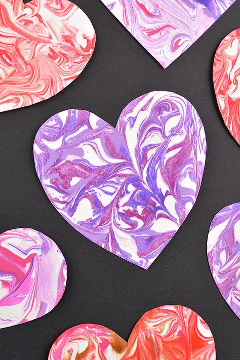 Create marbled shaving cream hearts and use them to make a homemade Valentine's Day card! It's such an easy art project for kids, and so fun to make unique marbling designs in the paint and shaving cream. They're the perfect craft for Valentine's Day, Mother's Day, or any day! Shaving Cream Art Preschool, Shaving Cream Hearts Valentines, Valentines Process Art For Toddlers, Marble Painting For Kids, Shaving Cream Marble Art, Puffy Paint Diy, Shaving Cream Painting Toddlers, Valentine Artwork, Mother’s Day Craft Blowing Hearts