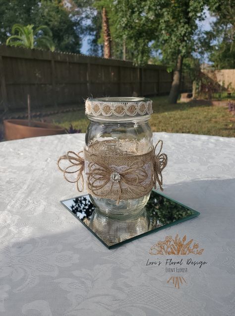 Rustic & Glam Mason Jar Centerpiece | Weddings | Bridal Shower | Baby Shower | Centerpieces | Burlap | Lace | Embellishment Perfect for Weddings, Bridal Showers, Baby Showers & Much More This design is all the way around! Each Jar is Made to order  16 oz. jars Rhinestone & Twine Lace Burlap If you have any questions feel free to message me.  If you are needing your items earlier please message me. *Mirror is for pictures/display Mirror is not included *Each item is handmade and design may vary. Jar Centerpiece Wedding, Mason Jar Centerpiece, Jar Centerpieces, Jar Decor, Rustic Glam, Mason Jar Centerpieces, Burlap Lace, Shower Centerpieces, Baby Shower Centerpieces