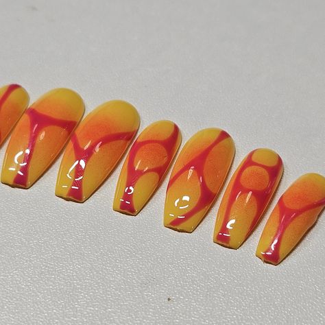 Set your nails ablaze with this stunning "Sunset Flame" press-on nail set. Featuring a bold blend of vibrant yellow and orange, each nail is uniquely adorned with a fiery pink abstract design that resembles glowing lava flows. These nails evoke the warmth and intensity of a summer sunset, perfect for making a statement. Hand-painted with precision and care, this set is perfect for any occasion--from casual outings to special events. Whether you're looking to spice up your everyday look or complete a standout ensemble, these press-ons are sure to turn heads. -Set includes 10 reusable nails -Available in various sizes for a custom fit -Long-lasting and durable Let your nails shine with the "Sunset Flame" set, and bring the heat to your style! Orange Sunset Nails, Lava Nails, Sunrise Nails, Sunset Nails, Orange Nail Designs, Stunning Sunset, Y2k Nails, Bring The Heat, Orange Nails