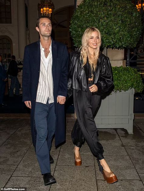 Sienna Miller, 42, looks stunning in a cropped leather jacket and silk trousers as she enjoys a date night with boyfriend Oli Green, 27, in Paris - eight months after welcoming their baby daughter | Daily Mail Online Sienna Miller Leather Jacket, Sienna Miller Aesthetic, Date Night With Boyfriend, Night With Boyfriend, Plain Black Crop Top, Sienna Miller Hair, Sienna Miller Style, Baby Daughter, Black Leather Shorts