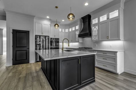 White Kitchen With Black Range Hood, Grey Kitchen With Black Island, Black Hood With White Cabinets, White Kitchen With Black Island And Hood, Black Hood Kitchen White Cabinets, Kitchen With Black Island White Cabinets, Black Island Gray Cabinets, Grey Kitchen Black Island, Black Island And White Cabinets