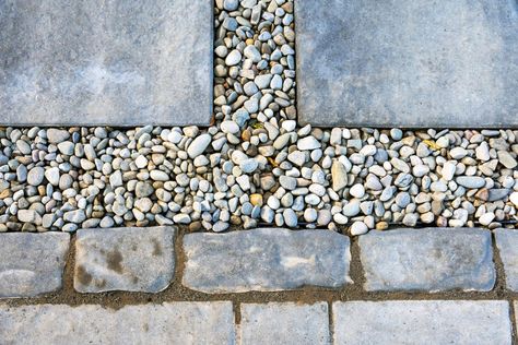 How To Keep Pea Gravel In Place Between Pavers? [Expert Tips] Pavers In Gravel Walkways, Gravel And Stepping Stone Side Yard, Pea Gravel Patio With Brick Edging, Gravel Between Pavers, Gravel Pathway With Stepping Stones, Rocks Between Concrete, Stone And Gravel Pathway, Keep Pea Gravel In Place, Pavers In Pea Gravel