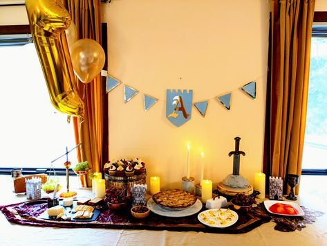 1st Birthday party table, medival/renaissance style with candles banner and sword in the stone cake. King Arthur Birthday Party, Rei Arthur, Medieval Party, Thomas Birthday, Birthday Party Tables, Birthday Table, King Arthur, Baby Birthday Party, Coming Of Age