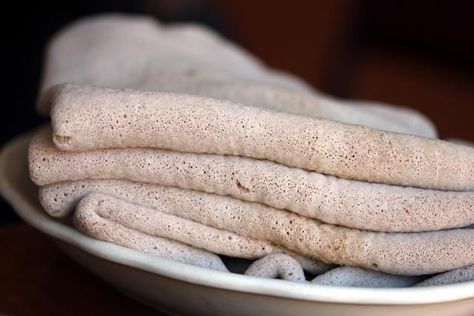 Injera Recipe. Injera is a sour Ethiopian flatbread usually prepared with teff flour. To learn how to make Injera, try this recipe! Sourdough Flatbread, Injera Bread, Teff Flour, Flatbread Recipe, African Cooking, Ethiopian Food, Nigerian Food, Flatbread Recipes, Vegan Bread