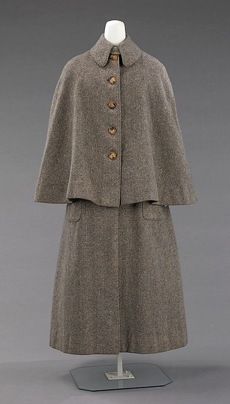 1885 Lady's Coat  Culture: British  This overcoat, which does not follow the bustle silhouette of the period, would have been worn for sporting activities where the popular bustle style would have been difficult to wear, such as shooting and hiking. It is well-made and presents standard construction details which are still in use on the modern overcoat. Ulster Coat, 1880s Fashion, Dress History, Gibson Girl, Victorian Clothing, Edwardian Fashion, Historical Dresses, Moda Vintage, Vintage Coat