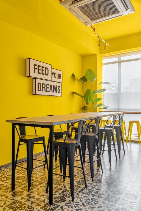 Image from The Expand Loft by Quirk Studio in Mumbai, India Bright Industrial Interior, Quirk Studio, Yellow Restaurant, Colorful Cafe, Small Restaurant Design, Small Seating Area, Modern Restaurant Design, Library Study, Design Brief