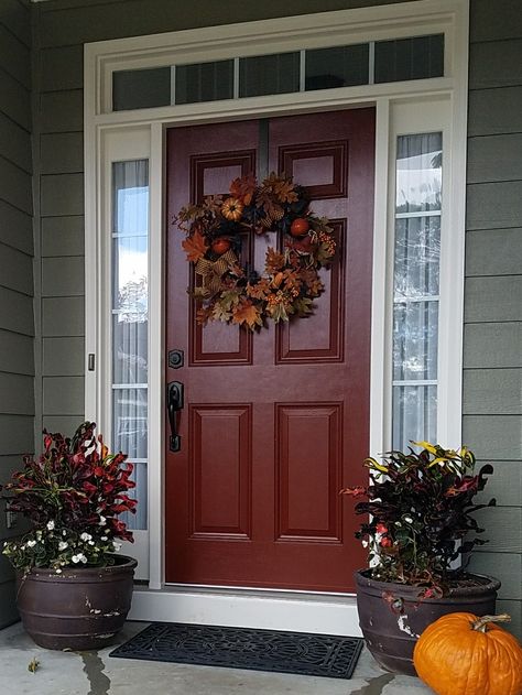 #carriagedoor #SherwinWilliams In love with our new front door color! Carriage Door Sherwin Williams Brick Red Front Door Color, Front Door Colors With Dark Brown House, Carriage Door Sherwin Williams, Wine Color Front Door, Red Door Front Porch Decorating Ideas, Houses With Red Front Doors, Cranberry Front Door Paint Colors, Burgundy Exterior Door, Front Door Color With Red Orange Brick