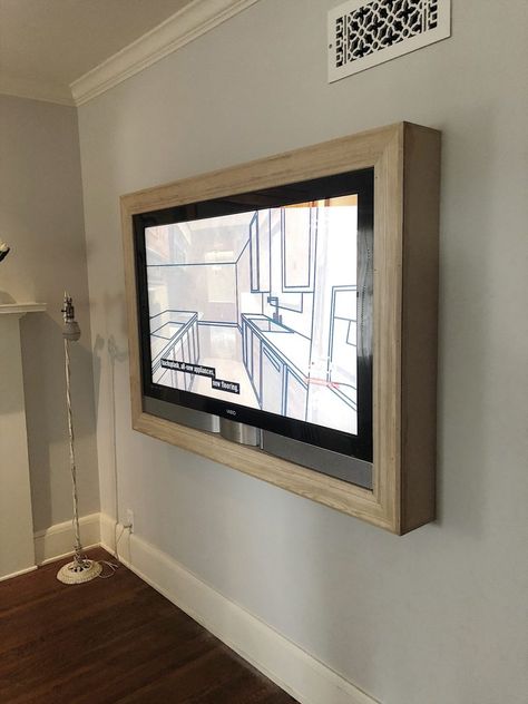 We love watching TV but I often don't love how televisions look in a room. Today I am going to share how to build an inexpensive TV art frame. Cornice Tv, Mounted Tv Ideas Living Rooms, Tv Mounted, Hanging Tv, Bedroom Tv Wall, Build A Frame, Suport Tv, Diy Dresser Makeover, Diy Accent Wall