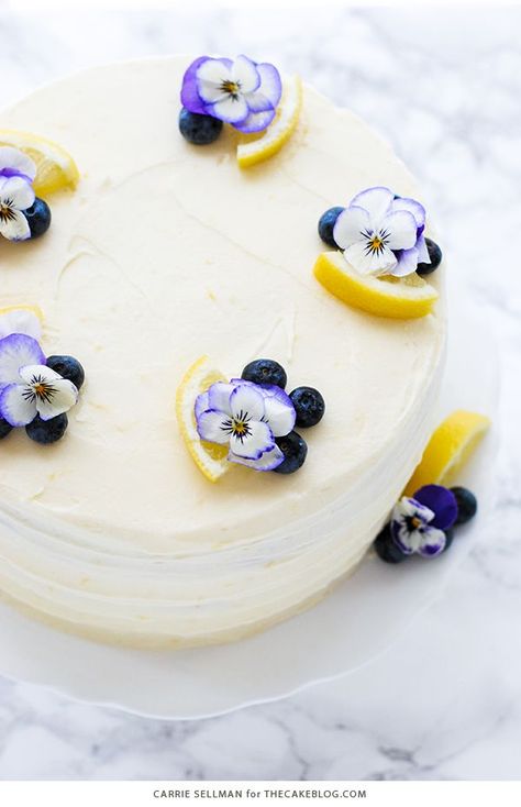 Lemon Blueberry Cake - lemon cake studded with wild blueberries, topped with lemon cream cheese frosting | by Carrie Sellman for TheCakeBlog.com Blueberry Cake Recipe, Blueberry Lemon Cake Recipe, Lemon Blueberry Cake, Mothers Day Desserts, Bolo Red Velvet, Blueberry Cake Recipes, Lemon Cream Cheese Frosting, Lemon Frosting, Blueberry Lemon Cake