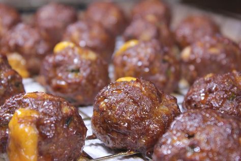 Meatballs and super bowl parties go hand in hand and when they are smoked meatballs full of cheesy goodness, it's a no brainer! Recipe and technique included. Super Bowl Meatballs, Smoked Meatballs, Smoker Recipes Electric, Cheesy Meatballs, Smoker Cooking, Traeger Recipes, Smoked Meats, Electric Smoker, Smoked Beef