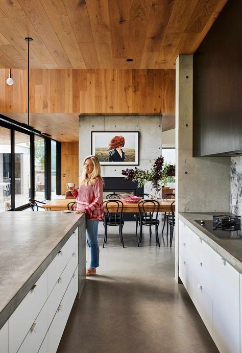 A concrete home in Barwon Heads with a future-proof design Concrete Floor Kitchen, Kitchen Concrete Floor, Concrete Kitchen Floor, Concrete Bench Top, Concrete Countertops Outdoor, Timber Kitchen, Timber Ceiling, Concrete Bench, Modern Renovation