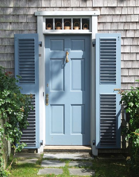 A doorway decorated with tiny lightship baskets, just outside downtown Nantucket. Nautical Front Door Decor, Nautical Front Door, Exterior Door Colors, Blue Front Door, Collection Board, Blue Doors, Vibeke Design, Nantucket Style, Door Paint Colors