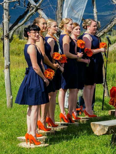 Orange and blue Broncos wedding,  simple fit and flare Audrey Hepburn style, figure flattering bridesmaids dresses, photography,  pictures, gerbera daisy bouquets Orange Blue And White Wedding, Daisy Bouquets, Blue Orange Weddings, Flattering Bridesmaid Dresses, Fall Wedding Bridesmaids, Navy Blue Bridesmaids, Dresses Photography, Burnt Orange Weddings, Orange Bridesmaid Dresses