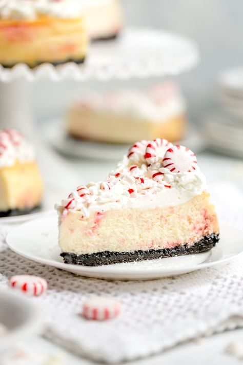 White Chocolate Peppermint Cheesecake - #sponsored Smooth and creamy white chocolate cheesecake infused with cool peppermint flavor, a substantial chocolate cookie crust, and a cloud cover of whipped cream make this cheesecake recipe the holiday season’s best, most beautiful dessert! @hphood #BakingWithSourPower #HoodSourCream White Chocolate Peppermint Cheesecake, Chocolate Mint Cheesecake, Chocolate Peppermint Cheesecake, Chocolate Cookie Crust, Mint Cheesecake, White Chocolate Peppermint, Peppermint Cheesecake, White Chocolate Cheesecake, Baking Items