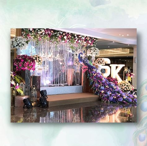 Now here's how you make a lavish statement! Bring a bit of art into your big day with unique installations like this one!  #weddingdecor #decor #decorideas #decorations #weddings #indianweddings #samanidecorators #indianweddingdecor #decorinstallation #peacock #floraldecor #floralideas #bigfatindianweddings Peacock Theme Wedding Decoration, Engagement Theme, Engagement Themes, Indian Reception, Wedding Stage Backdrop, Flower Garland Wedding, Wedding Stage Design, Peacock Theme, Desi Wedding Decor