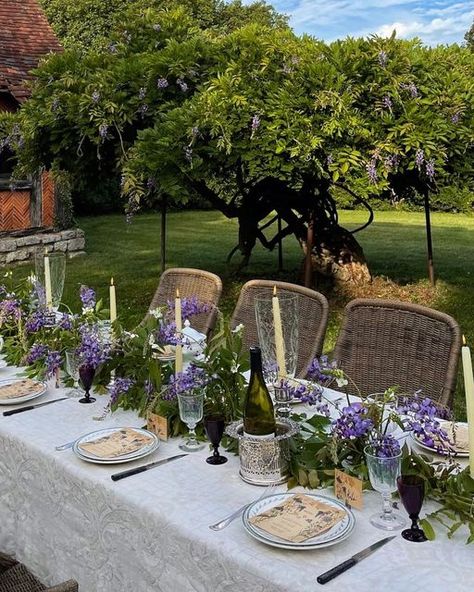 Maison Fête on Instagram: "A table I set this time last year under the wisteria trees 🌿 I used vintage floral frogs in shallow bowls to create a waterfall effect of wisteria down the center, and trailed the vines between them to disguise the bowls. 💜 There are still a few blooming for your end of summer tables! #wisteria #antiquetable #artdetable #wisteriagarden #frenchchateau #bonweekend #maisonfete" Wisteria Wedding, Wisteria Garden, Wisteria Tree, French Exterior, Wedding Renewal Vows, Dinner Party Summer, Summer Dining, Table Inspiration, Summer Tables