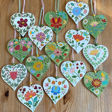 After a little creative break, I’m back with these hand-painted wooden hearts 💚🤍. Each one is painted with colorful folk art flowers 🌷🌸. It feels so good to be painting again 🎨. Which one’s your favorite? . . . #folkart #folkflowers #floraldecoration #woodenhearts #hangingdecor #paintingflowers #folk #handmadeisbetter #handmadeuk #handmadedesign Folk Art Ornament, Norwegian Folk Art, Clay Magnets, Folk Art Flowers, Painted Hearts, Christmas Card Crafts, Ornament Ideas, Card Crafts, Art Flowers