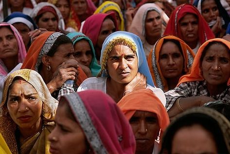 Women at village meeting, India. 'In much of the rural majority world, women do most of the farm work, while men make most of the decisions,' says the Hard Rain Project. 'The men are usually listed as owning the land, but they often work elsewhere. So when government agents come calling with a training programme or credit scheme, they ignore the women running the farms because their names are not on government lists. Earth Exhibition, Farm Work, Rural Women, Women Working, Whole Earth, Women Running, Bob Dylan, Training Programs, Running Women