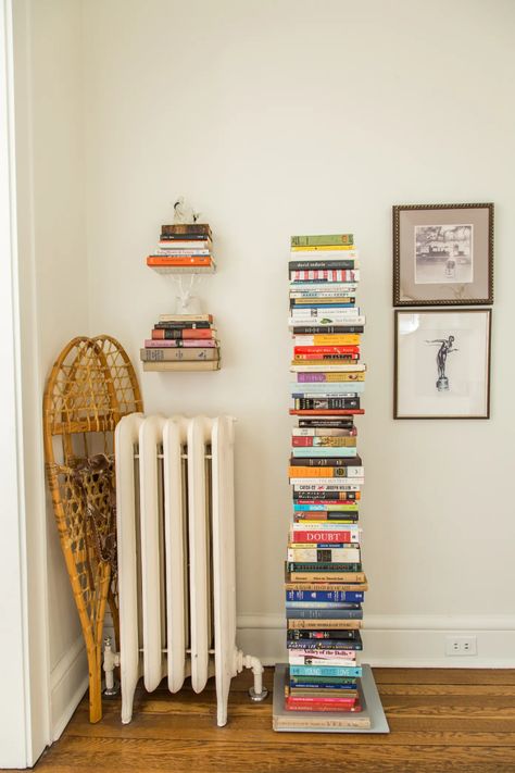 Book Tower Decor, Bookcase In Entryway, Colorful Apartment Ideas, Apartment Room Decor, Purplish Grey, Book Tower, Boho Apartments, Greenish Grey, Neutral Bedroom Decor