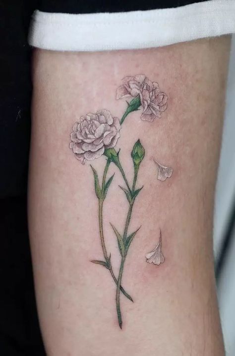 The Meanings Of Carnation Tattoos (Explained In Detail) Carnation Tattoos, Tattoo Between Breast, Carnation Flower Tattoo, Carnation Tattoo, White Rose Tattoos, Purple Tattoos, Purple Carnations, Rose Drawing Tattoo, Cool Wrist Tattoos