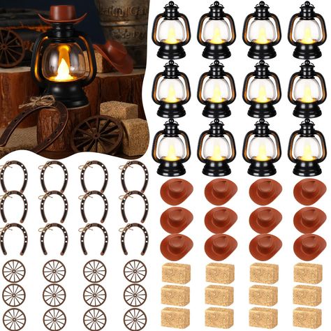 PRICES MAY VARY. Complete Western Themed Party Decorations Set: this collection consists of 120 combined sets of western cowboy theme party decorations; The package offers 24 mini lanterns, 24 mini cowboy hats, 24 mini horseshoes, 24 wagon wheels and 24 hay bales; This inclusive package will meet all your decorative needs, allowing for extra items to be stored for future use Delicate Western Cowboy Theme: our western theme centerpieces are suitable for those with a love for the west and cowboy c Cowboy Party Centerpiece Western Theme, Western Themed Decor, Rustic Western Party Decor, Centerpiece For 50th Birthday Party, Fall Western Wedding Table Decor, Rodeo Table Decorations, Saloon Party Decorations, Rodeo Theme Party Decor, Western Gender Reveal Decorations