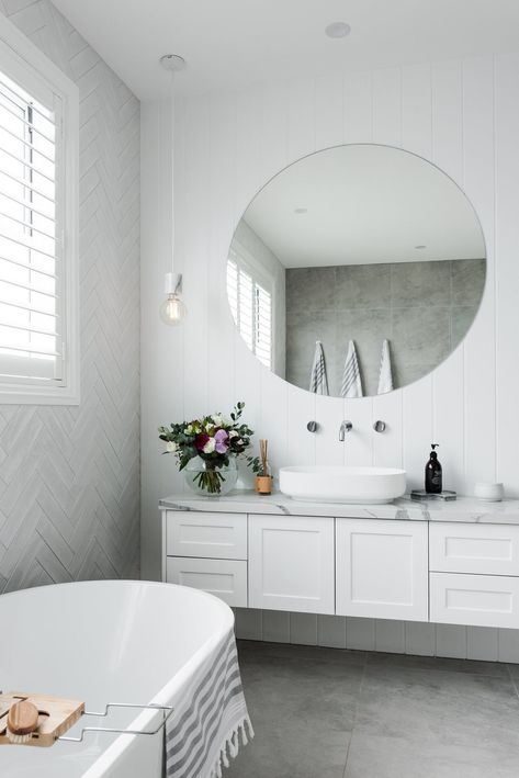 Herringbone tile feature | white tiles | subway tiles | soft concrete look tiles with marble top vanity 👌Contemporary Hampton’s bathroom using subway opal and Bavaria. #bathroom #bathroomdesign #bathroomdesignideas #interiordesignideas #tiles #hamptons #modernfarmhouse #amberkellyville #topbathroomdesigns Hampton Style Bathrooms, Marble Top Vanity, Concrete Look Tiles, Tiled Bathroom, Trendy Bathroom Tiles, Bad Inspiration, Stunning Bathrooms, Herringbone Tile, Marble Vanity Tops