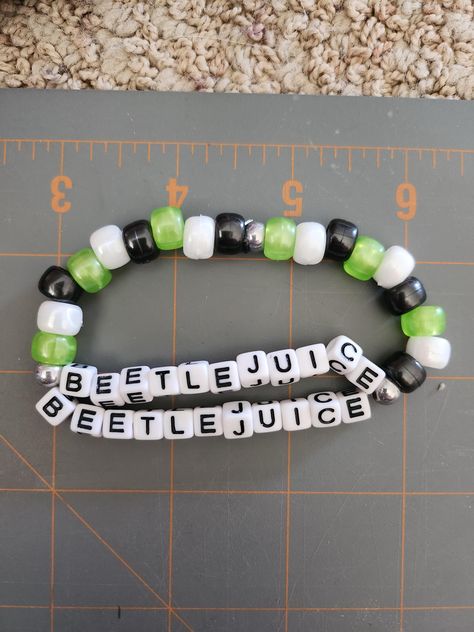 Beetlejuice Beetlejuice Beetlejuice! Do you love Beetlejuice? Show off this colorful bracelet inspired by the new movie. Perfect for the Halloween movie fan.  Made with pony beads, and letter beads, this bracelet is sure to bring a smile to your face throughout the whole spooky season. Bracelet Ideas With Pony Beads, Beetlejuice Bracelet, Kandi Inspiration, Pony Bead Jewelry, Kandi Inspo, Pony Bead Bracelets, Pony Bead Crafts, Kandi Ideas, Beetle Juice