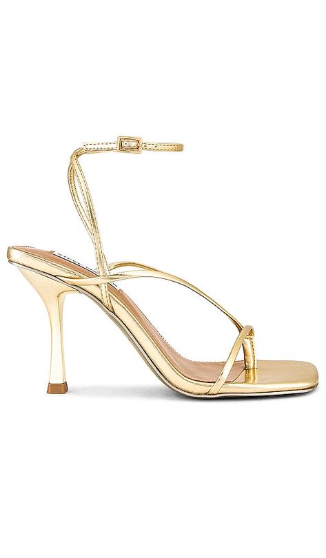 Find STEVE MADDEN Annie Heel In Metallic Gold on Editorialist. Steve Madden Annie Heel in Metallic Gold. - size 10 (also in 11, 6, 6.5, 7, 7.5, 8, 8.5, 9, 9.5) Steve Madden Annie Heel in Metallic Gold. - size 10 (also in 11, 6, 6.5, 7, 7.5, 8, 8.5, 9, 9.5) Metallic faux leather upper with manmade sole. Made in China. Ankle buckle closure. Faux padded leather insole. Faux leather lining. Slanted square toe. Approx 90mm/ 3.5 inch heel. SMAD-WZ1106. ANNI06S1242. The effortless west coast vibe of BB Grad Heels, Hoco Heels, Hoco Shoes, Hoco Ideas, Steve Madden High Heels, Glamorous Fashion, Prom Inspo, Shoes Heels Classy, Homecoming Outfits