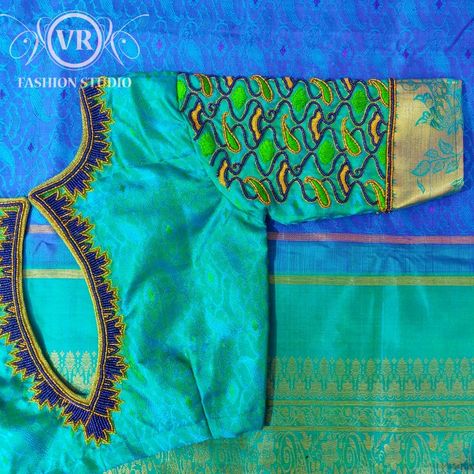 Green embroidery blouse with tube beads, sugar beads and zari threads Blue Blouse Designs, Work Blouse Designs, Blouse Designs Catalogue, Maggam Work Blouse, Traditional Blouse Designs, Wedding Saree Blouse Designs, Blouse Design Images, Cutwork Blouse Designs, Wedding Blouse Designs