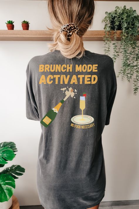 Get ready to conquer brunch with this stylish t-shirt! Featuring 'Brunch Mode' on the front and 'Brunch Mode Activated' on the back, complete with a chic champagne bottle graphic and a mimosa on a plate. No food necessary with this fun and fashionable tee. Perfect for brunch enthusiasts, champagne lovers, and those who know how to brunch in style. Stand out in this unique design and make a statement at your next brunch outing or social event. #BrunchMode #ChampagneLovers #TrendyTees #MimosaLove Brunch Attire, Brunch Decor, Shirt Pins, Social Events, Mimosa, Party Shirts, Tshirt Colors, Brunch Recipes, Comfort Colors