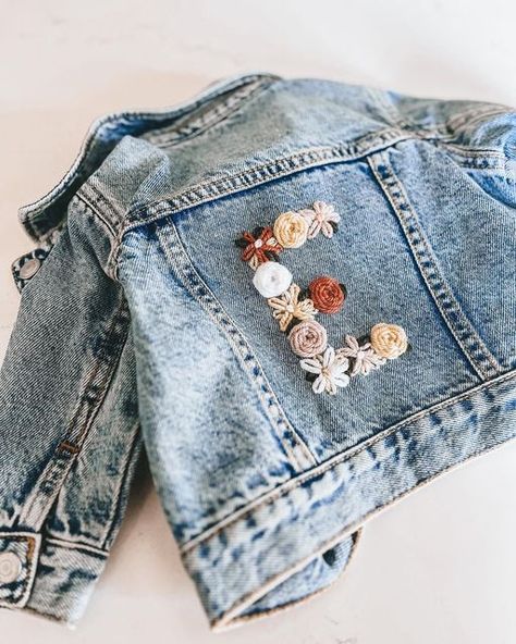 Knotty Boys Co on Instagram: "Jean Jacket flower letters coming soon! Who’s in!? Swipe if you love matching your mini!! 🤍🌸 • • • • • #shopsmall #shoplocal #smallbusiness #supportsmallbusiness #handmade #shopsmallbusiness #supportlocal #etsy #fashion #etsyshop #ootd #smallbusinessowner #homedecor #etsyseller #love #shop #shopping #boutique #style #giftideas #onlineshopping #handmadewithlove #etsyvancouver #etsycanada #boutiqueshopping #handcrafted #etsysellersofinstagram #etsylove #handmade #ki Hand Embroidered Jean Jacket, Jean Jacket Embroidery Diy, Diy Embroidered Jean Jacket, Embroidery Jeans Jacket, Shopping Boutique, Clothes Embroidery Diy, Simple Hand Embroidery Patterns, Embroidered Jean Jacket, Hand Embroidery Projects