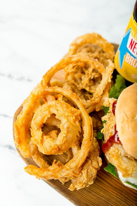 Beer Battered Onion Rings are the perfect complement to any burger, game day BBQ, or just settling that craving for your favorite fair food. It only takes two onions to serve up a crowd, but be warned, they’ll be hungry for more! Beer Batter Onion Rings Recipe, Battered Onion Rings Recipe, Beer Batter Onion Rings, Burger Pairings, Batter Onion Rings, Battered Onion Rings, Dutch Oven Recipes Cast Iron, Beer Battered Onion Rings, Onion Rings Recipe