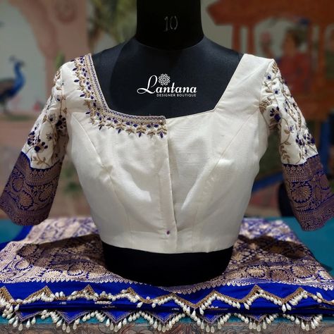 Royal Blue And White Embroidery Blouse ❣️ The grace of Tradition with this beautifully Embroidered White blouse features Intricate Blue and Golden design. Royal blue sarre adored with stunning Golden motifs this ensemble for Special occasions 💙💙 @lantanaboutiquebangalore Marathahalli ,Bangalore #blueblouse #threadwork #tassels #sareeborder #new #goldenmotifs #blue #white #saree #embroidery #embroiderydesign #mohurtham #trending #designerblouse Embroidery On White Blouse, White Saree Embroidery, White Embroidery Blouse, Saree Embroidery, Golden Design, Hand Work Blouse, White Saree, Maggam Work Blouses, Saree Border